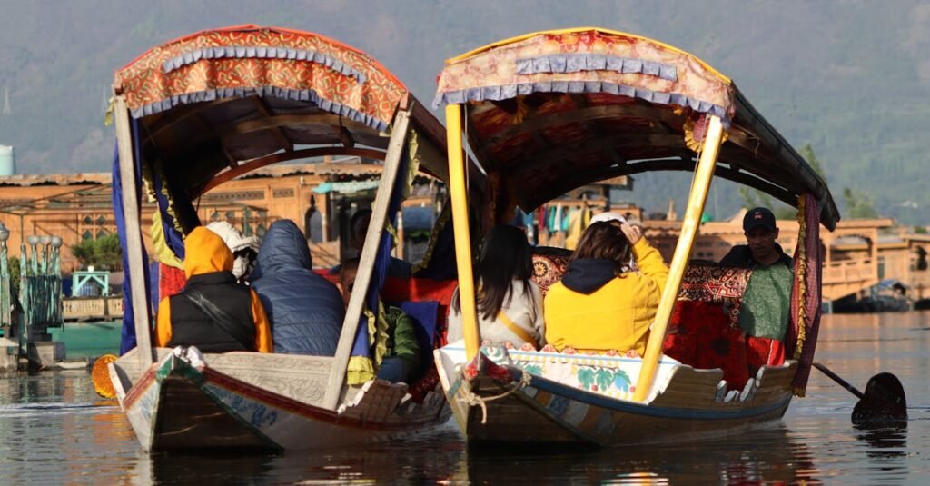 Tourists enjoy a peaceful boat ride on Dal Lake in Srinagar, Kashmir.