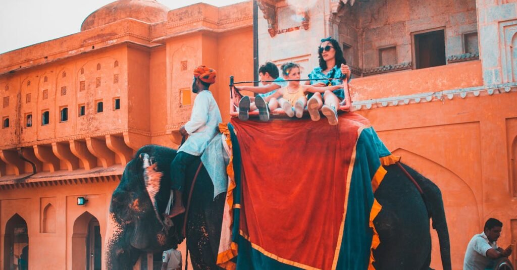Tourists enjoying an elephant ride at Amber Fort in Jaipur, capturing vibrant Indian architecture and culture.